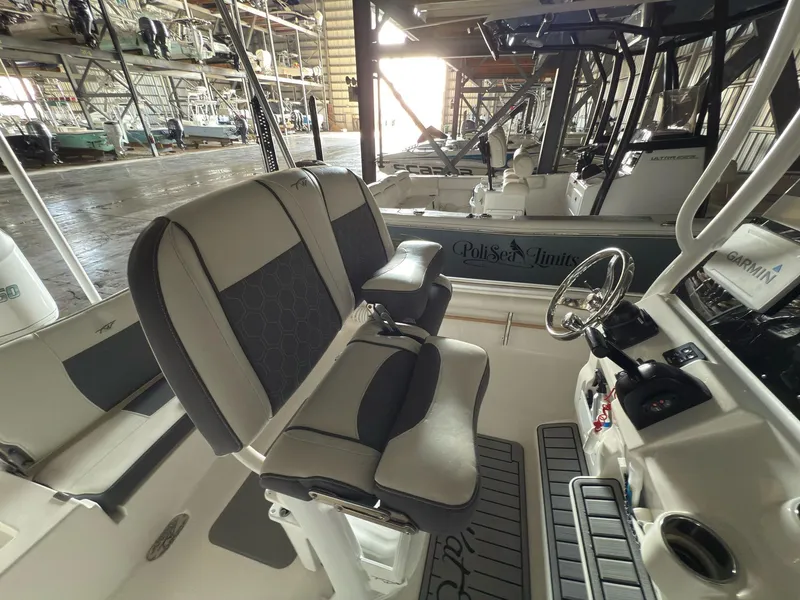 Slide: The Image of 2020 Tidewater 2300 Carolina Bay boat interior with seating and steering console. - 21