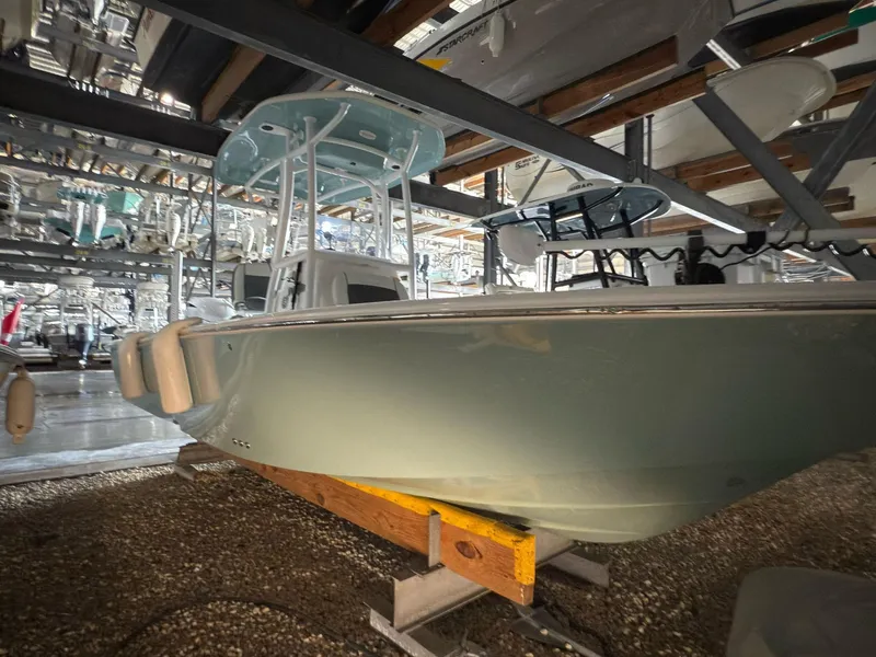 Slide: The Image of 2020 Tidewater 2300 Carolina Bay boat stored indoors on a rack. - 4