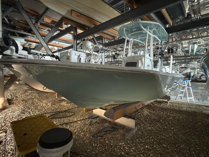 Slide: The Image of 2020 Tidewater 2300 Carolina Bay boat in storage, showcasing sleek design and sturdy build. - 5