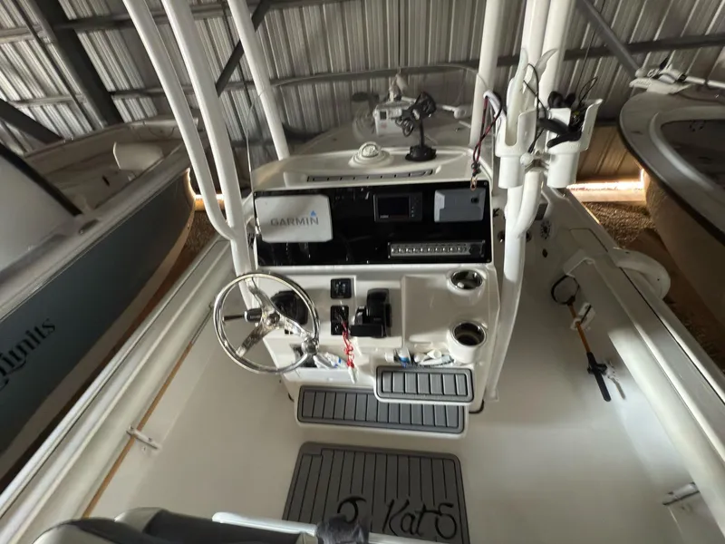Slide: The Image of 2020 Tidewater 2300 Carolina Bay boat interior with steering console and navigation equipment. - 6