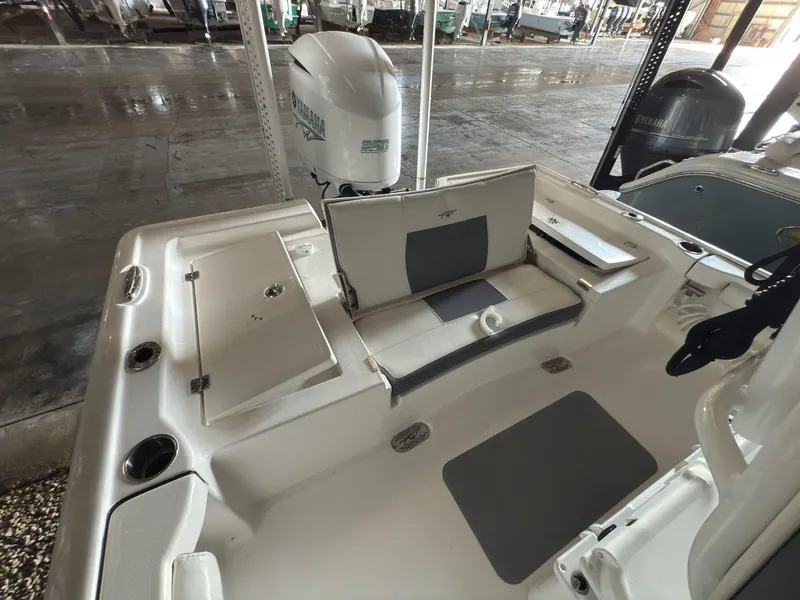Slide: The Image of 2020 Tidewater 2300 Carolina Bay boat interior with seating and storage compartments. - 8