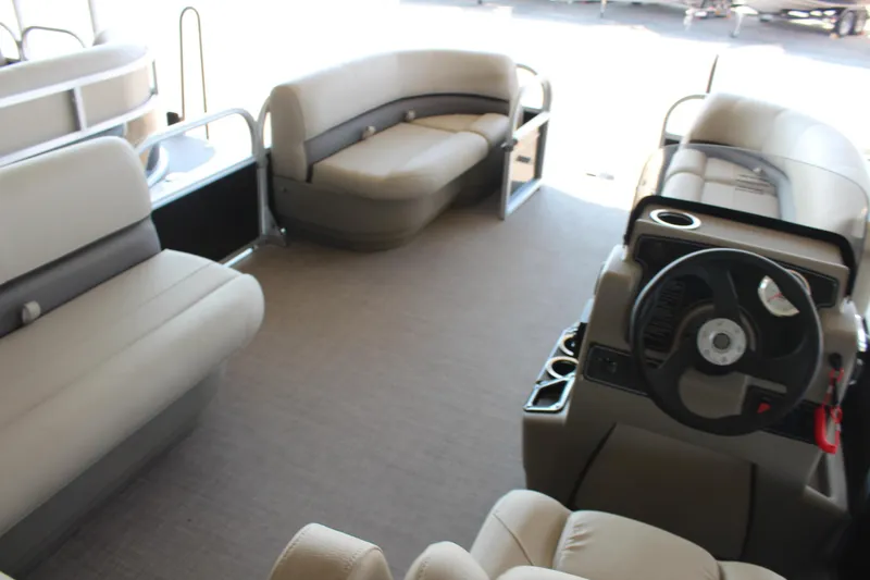 Slide: The Image of Interior of 2025 Sun Tracker Party Barge 16 DLX pontoon boat with beige seating. - 6