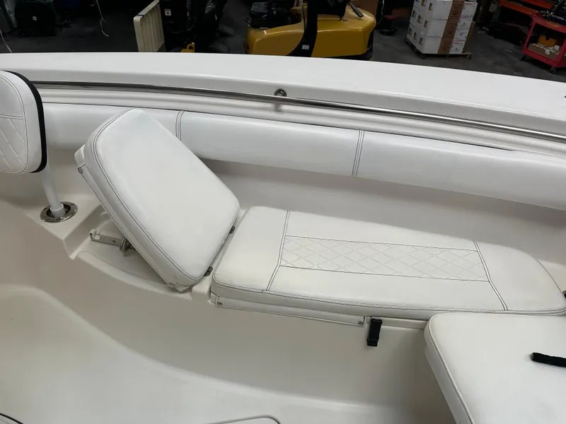Slide: The Image of 2020 Sea Pro 259 Center Console boat with white cushioned seating. - 17