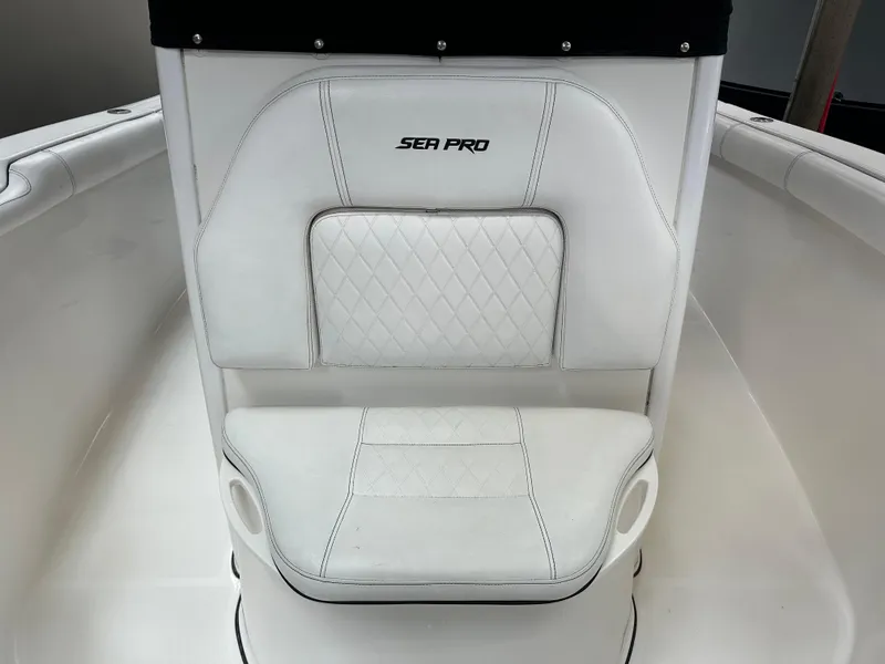 Slide: The Image of 2020 Sea Pro 259 Center Console boat seat with white upholstery and diamond stitching. - 19