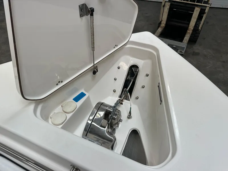 Slide: The Image of 2020 Sea Pro 259 Center Console anchor compartment with open hatch. - 21