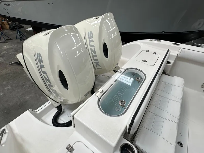 Slide: The Image of 2020 Sea Pro 259 Center Console with twin Suzuki outboard engines. - 4