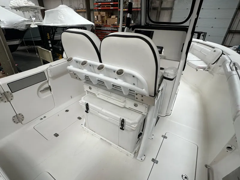 Slide: The Image of 2020 Sea Pro 259 Center Console boat interior with dual seats and storage. - 8