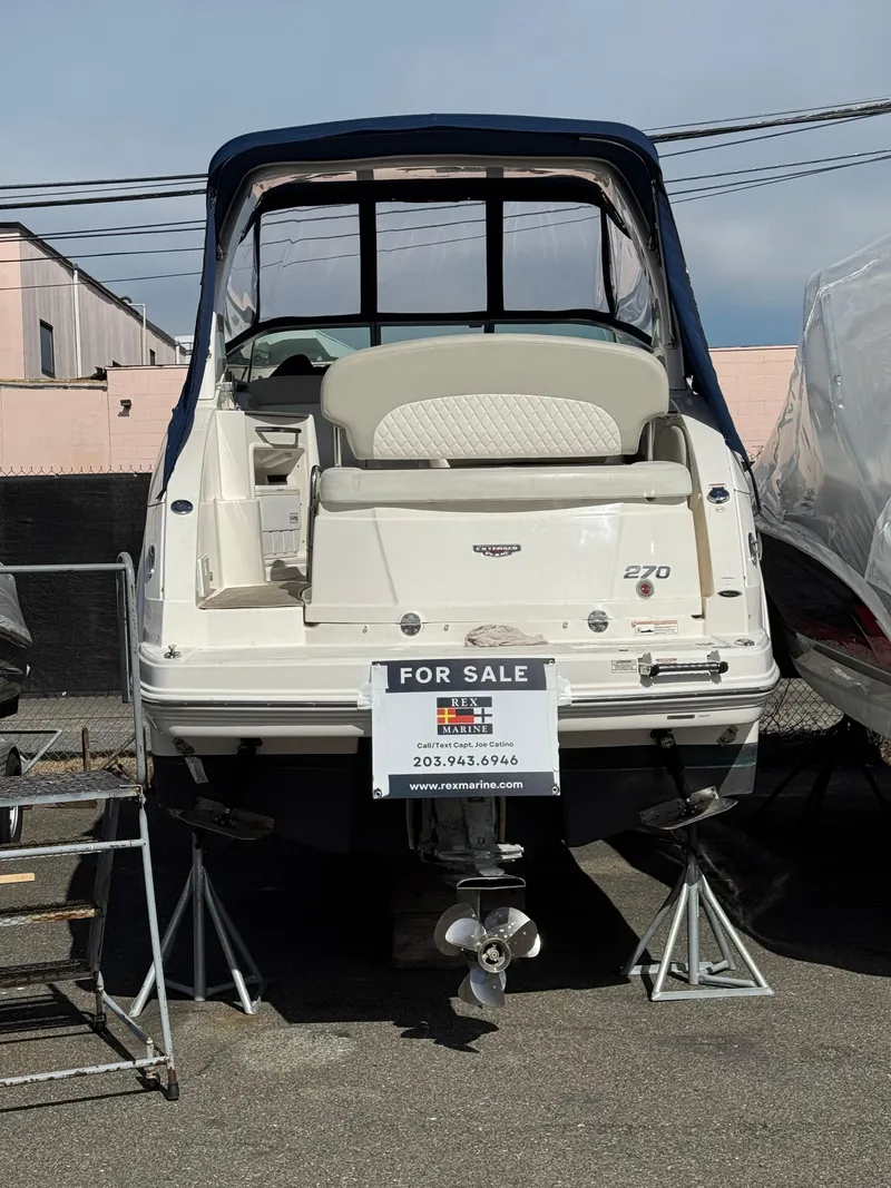 Slide: The Image of 2014 Chaparral 270 Signature boat for sale, displayed on stands. - 20