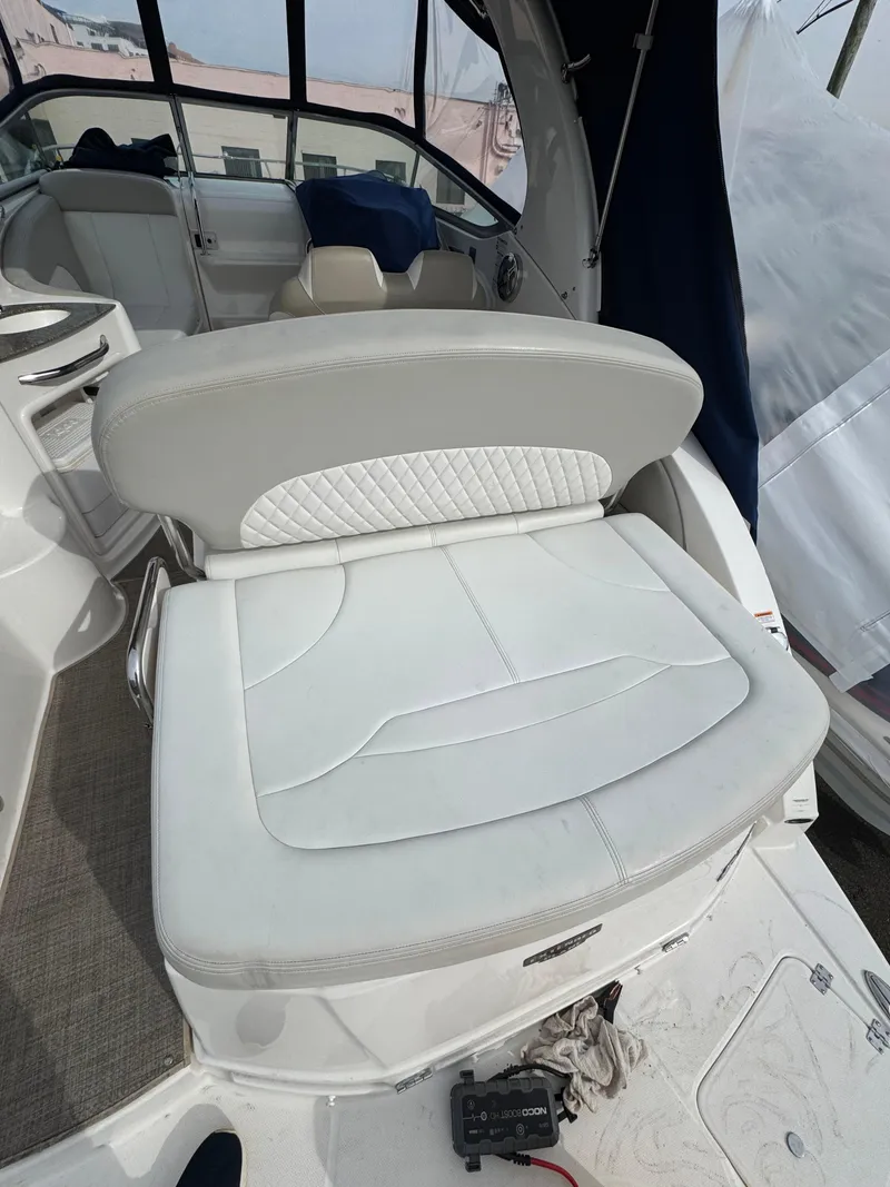 Slide: The Image of 2014 Chaparral 270 Signature boat interior with white seating and modern design. - 22