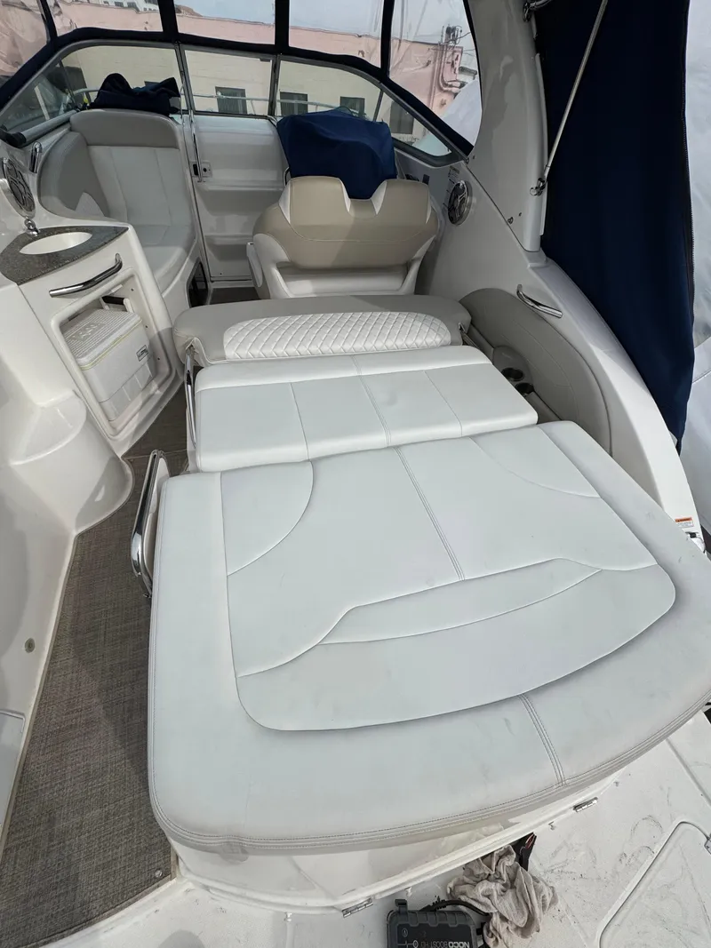 Slide: The Image of 2014 Chaparral 270 Signature boat interior with white seating and modern design. - 24