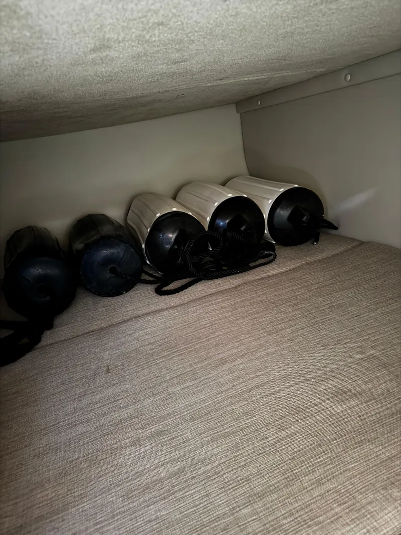 Slide: The Image of Boat fenders stored in Chaparral 270 Signature, 2014 model, interior view. - 28