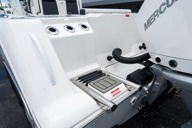 Slide: The Image of 2025 Tidewater 302CC Adventure boat with Mercury engine and integrated swim ladder. - 15