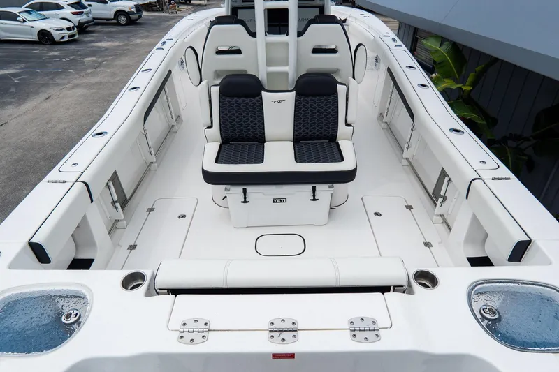 Slide: The Image of 2025 Tidewater 302CC Adventure boat interior with seating and storage compartments. - 16