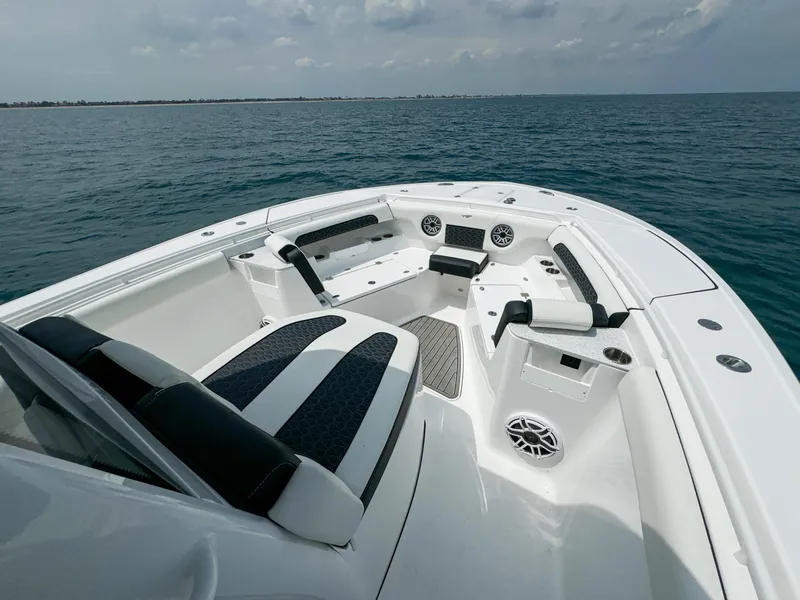 Slide: The Image of 2025 Tidewater 302CC Adventure boat with spacious seating on open water. - 6