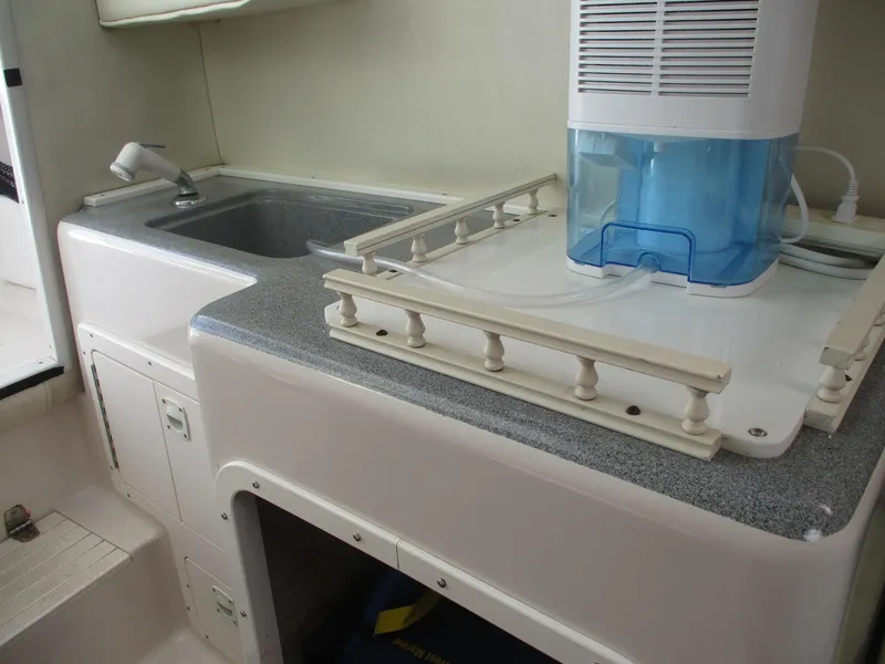 Slide: The Image of 1997 Pro-Line 251 WA boat interior with sink and countertop. - 17