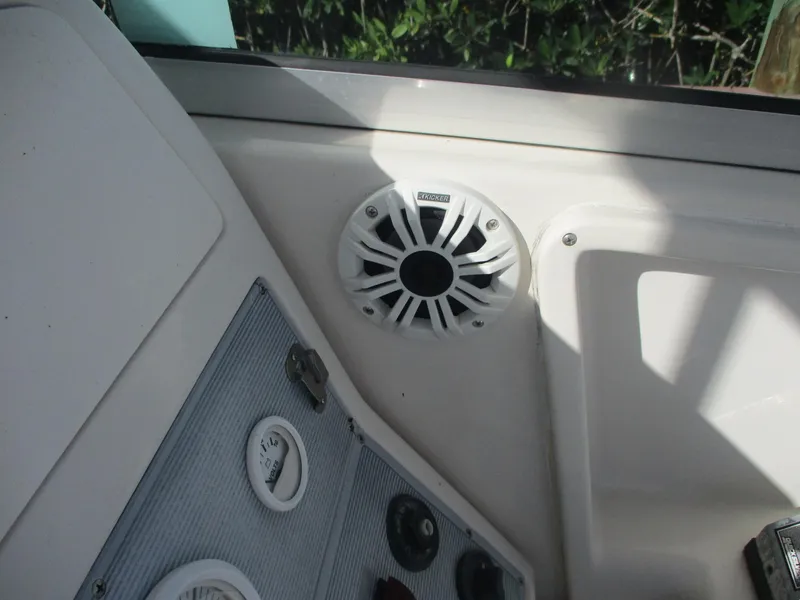 Slide: The Image of 1997 Pro-Line 251 WA boat interior with speaker and control panel. - 21