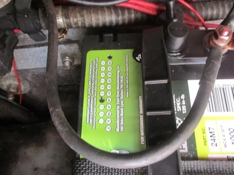 Slide: The Image of Battery compartment of a 1997 Pro-Line 251 WA boat, showing wiring and connections. - 9