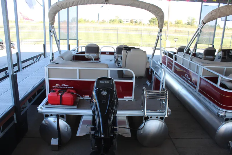 Slide: The Image of 2025 Sun Tracker Bass Buggy 16 XL Select pontoon boat with outboard motor. - 3