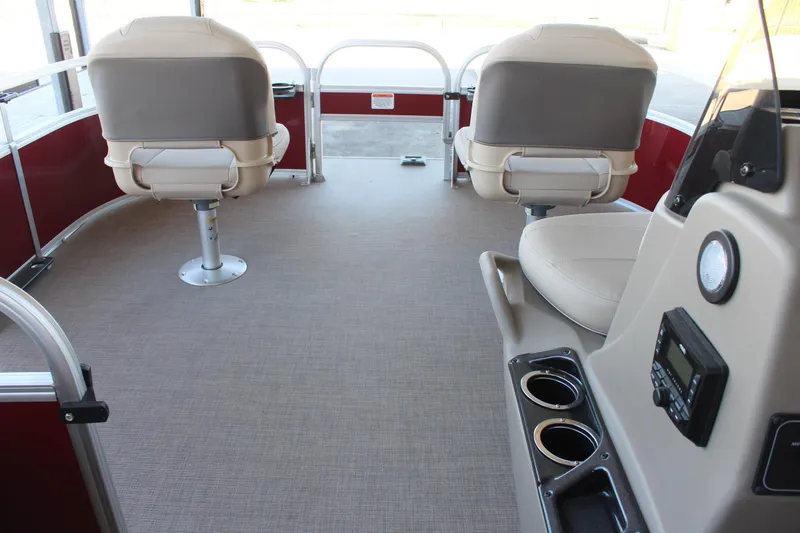 Slide: The Image of 2025 Sun Tracker Bass Buggy 16 XL Select interior with seating and control panel. - 9