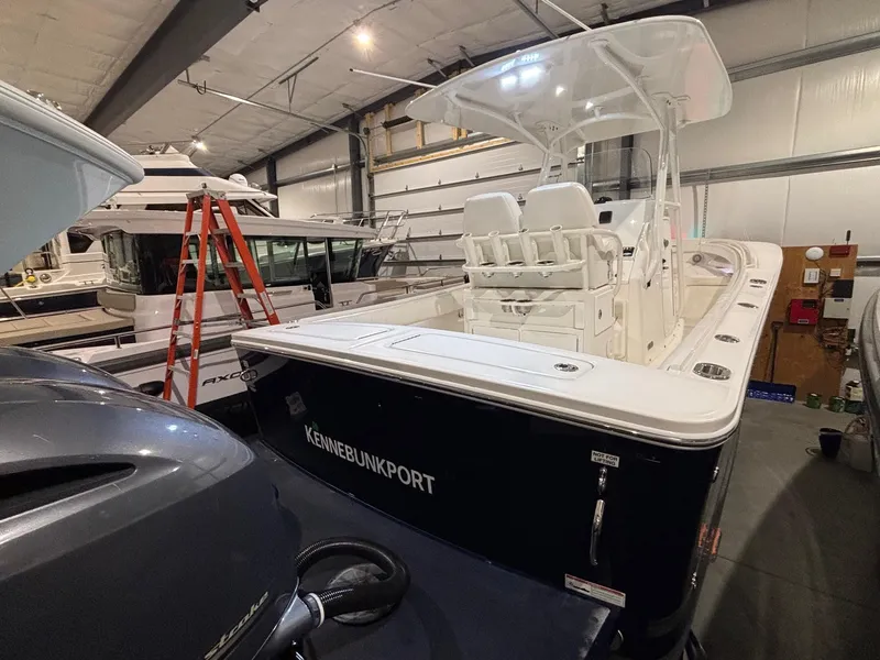 Slide: The Image of 2015 Regulator 25 boat in storage, Kennebunkport, indoor facility. - 12