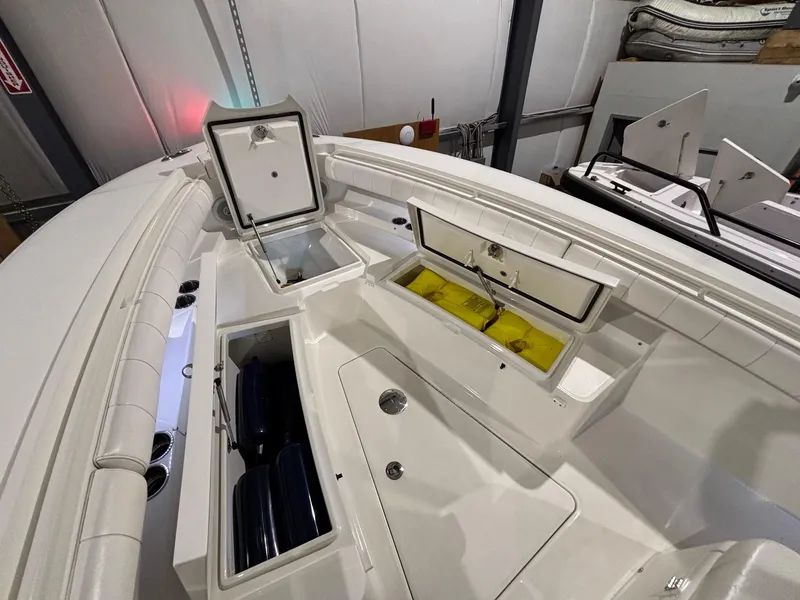 Slide: The Image of 2015 Regulator 25 boat interior with open storage compartments. - 23