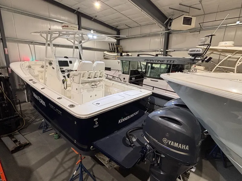 Slide: The Image of 2015 Regulator 25 boat with Yamaha engine in indoor storage facility. - 3