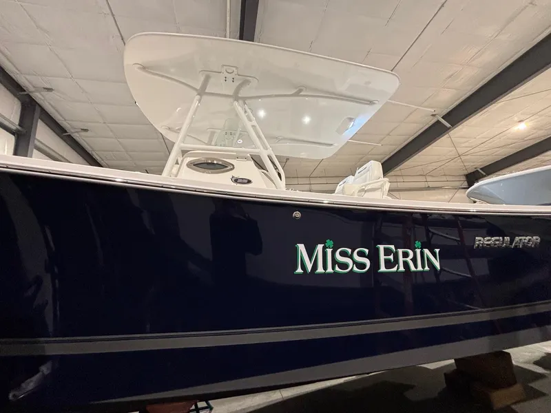 Slide: The Image of 2015 Regulator 25 boat named "Miss Erin" in indoor storage. - 4
