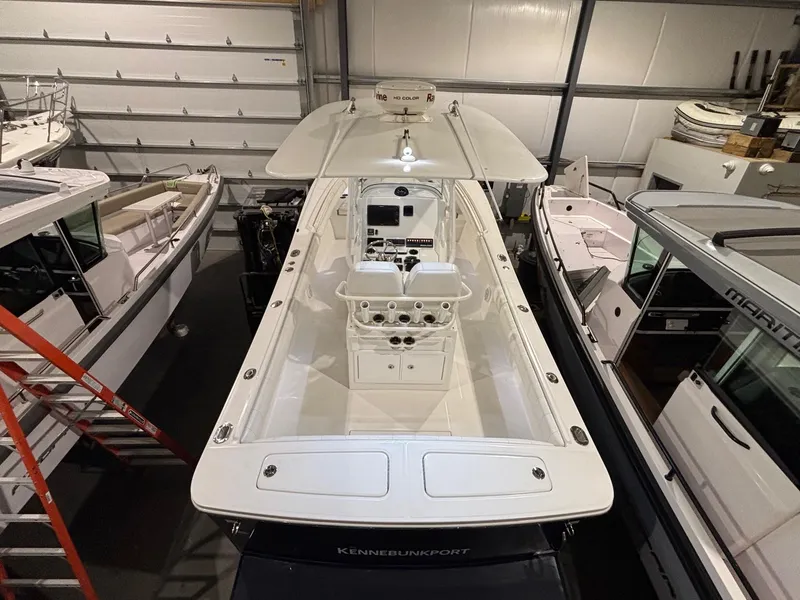 Slide: The Image of 2015 Regulator 25 boat in storage, top view, surrounded by other boats. - 44