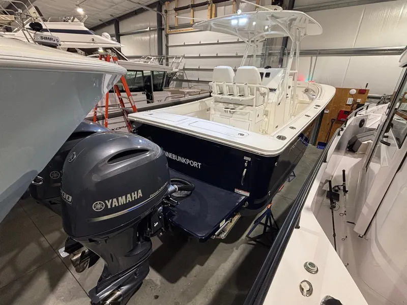 Slide: The Image of 2015 Regulator 25 boat with Yamaha engines in indoor storage. - 6