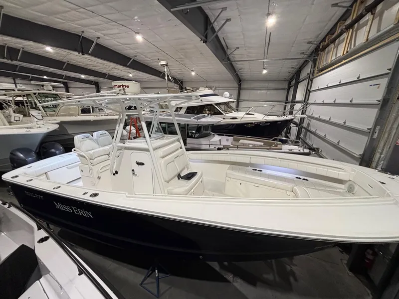 Slide: The Image of 2015 Regulator 25 boat in storage, featuring sleek design and spacious seating. - 7