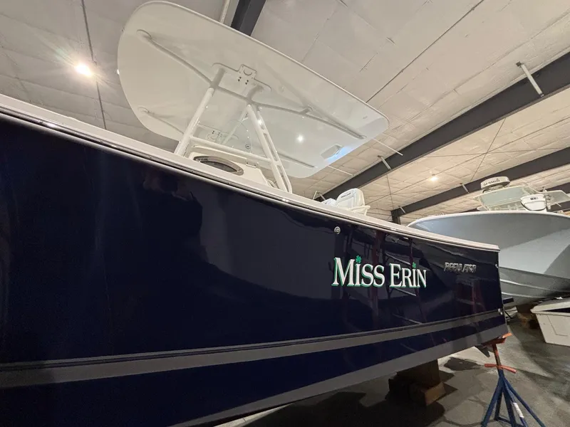 Slide: The Image of 2015 Regulator 25 boat named "Miss Erin" in indoor storage. - 9