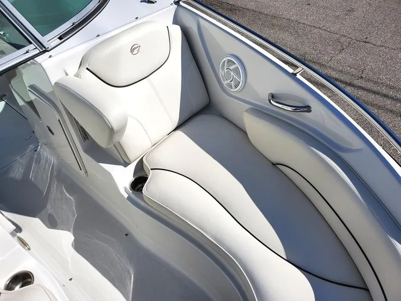 Slide: The Image of 2011 Crownline 230LS BR boat interior with white seating and speaker detail. - 14