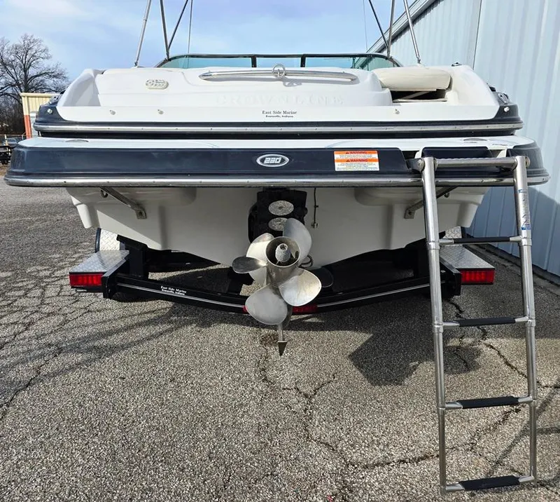 Slide: The Image of 2011 Crownline 230LS BR boat rear view with propeller and ladder. - 19