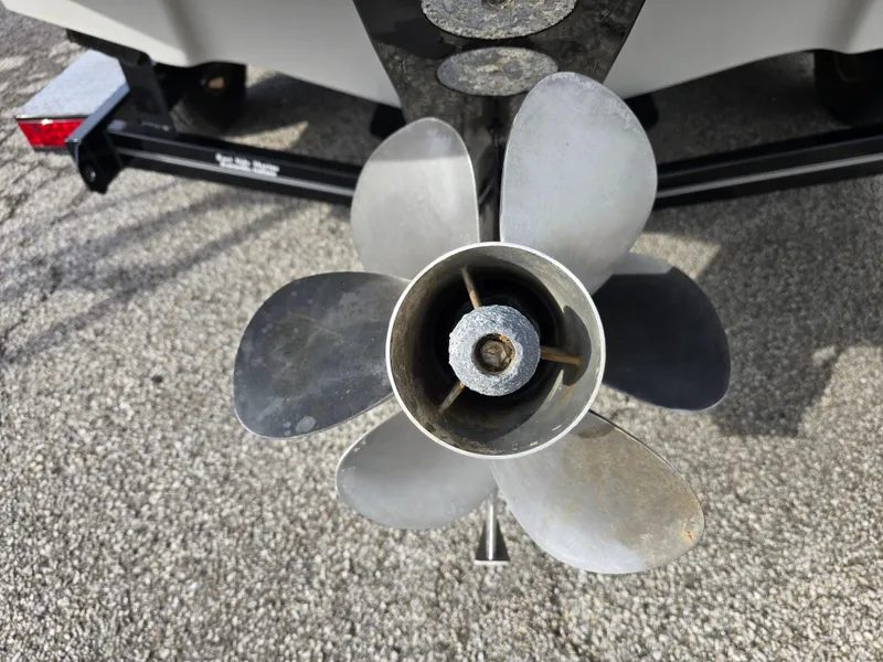 Slide: The Image of Propeller of 2011 Crownline 230LS BR boat on trailer, close-up view. - 21