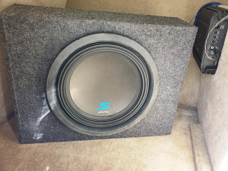 Slide: The Image of Subwoofer in 2011 Crownline 230LS BR boat, enhancing audio experience. - 26