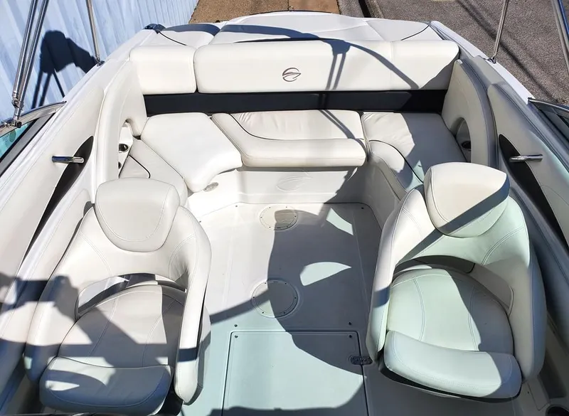 Slide: The Image of 2011 Crownline 230LS BR boat interior with white leather seating. - 4