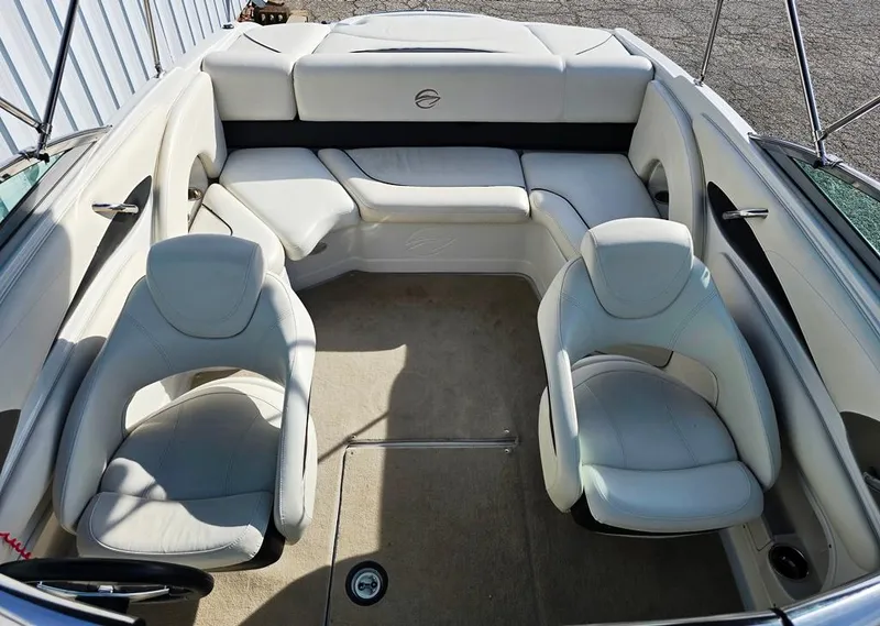 Slide: The Image of 2011 Crownline 230LS BR boat interior with white seating and spacious layout. - 5