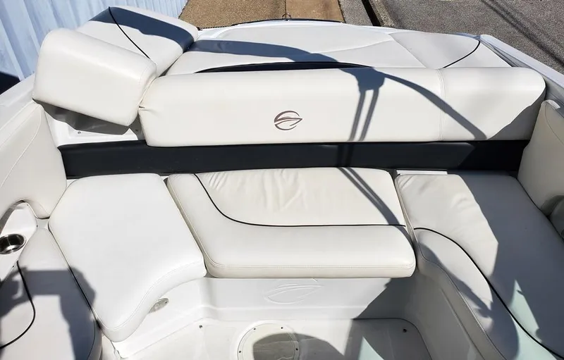 Slide: The Image of 2011 Crownline 230LS BR boat interior with white leather seating. - 6