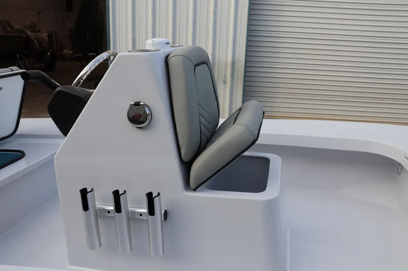 Slide: The Image of Custom Texar Flats Hybrid 16 boat seat, 2025 model, with storage and rod holders. - 9