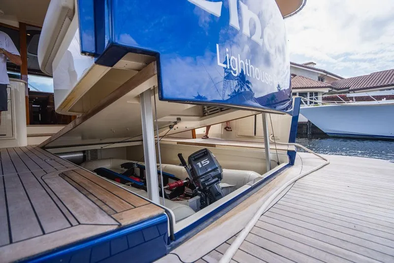 Slide: The Image of 2015 Palm Beach Motor Yachts PB52 with open storage compartment at dockside. - 10