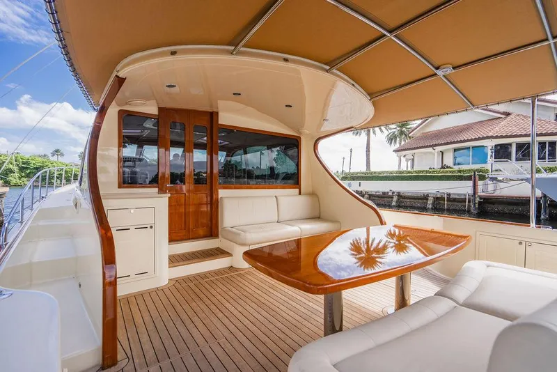 Slide: The Image of Luxurious 2015 Palm Beach Motor Yachts PB52 with elegant teak deck and spacious seating area. - 13