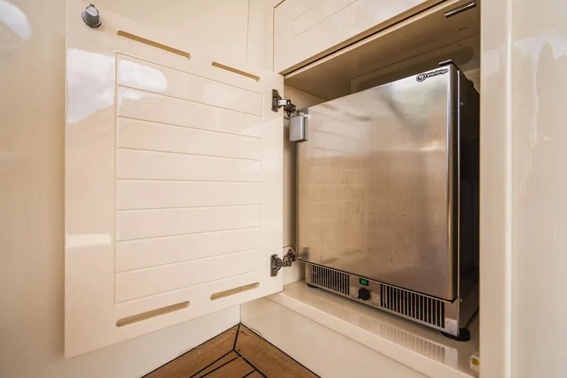 Slide: The Image of Stainless steel refrigerator in 2015 Palm Beach Motor Yachts PB52 interior. - 21