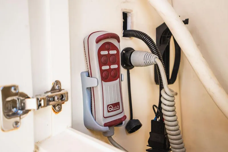 Slide: The Image of Remote control in a 2015 Palm Beach Motor Yachts PB52, mounted on a wall. - 22