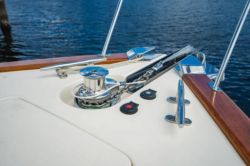 Slide: The Image of 2015 Palm Beach Motor Yachts PB52 deck detail with chrome fittings and wooden accents. - 25