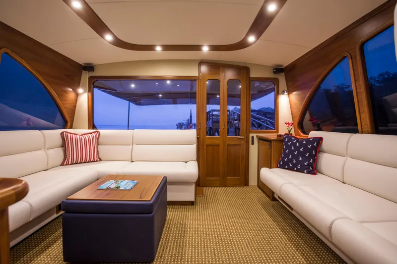 Slide: The Image of Luxurious interior of 2015 Palm Beach Motor Yachts PB52 with elegant seating and wooden accents. - 37