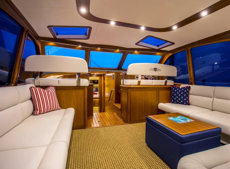 Slide: The Image of Luxurious interior of 2015 Palm Beach Motor Yachts PB52 with elegant seating and wood accents. - 38