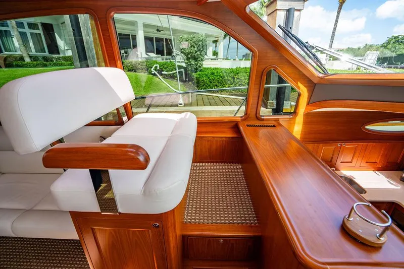 Slide: The Image of Luxurious interior of 2015 Palm Beach Motor Yachts PB52, featuring elegant wood and leather design. - 39