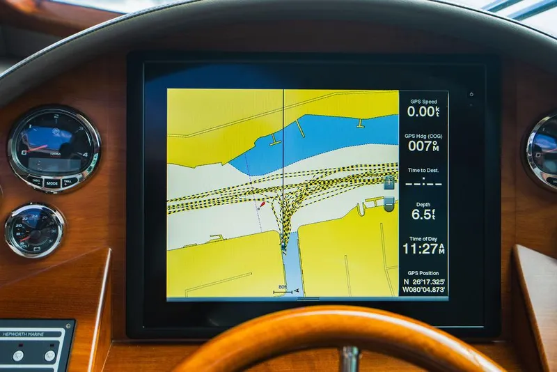 Slide: The Image of Navigation display on 2015 Palm Beach Motor Yachts PB52, showing GPS and depth information. - 45
