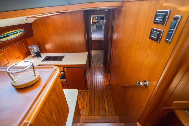 Slide: The Image of Interior of 2015 Palm Beach Motor Yachts PB52 with wooden finishes and modern amenities. - 49