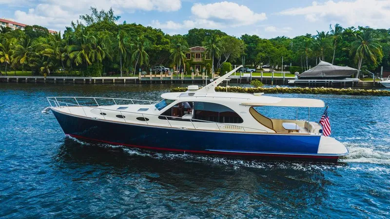 Slide: The Image of 2015 Palm Beach Motor Yachts PB52 cruising on a scenic waterway. - 7